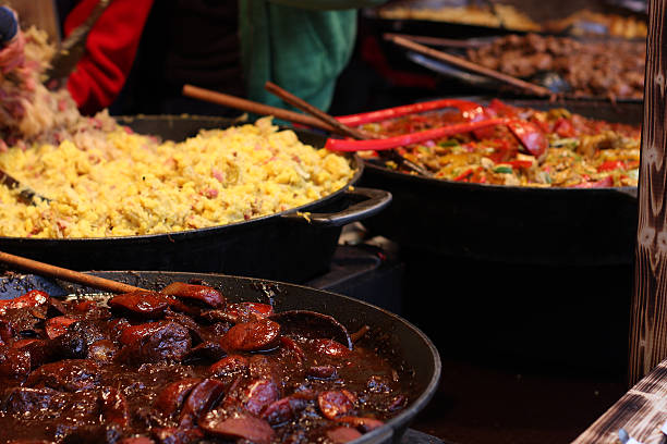 istock Cooking  meal  in great pan on christmas market 499335332