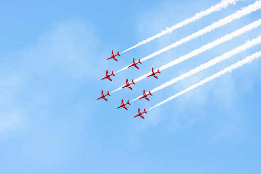 Tallinn, Estonia - June 23, 2014: Red Arrow aerobatic flight show with red fighter jets in Tallinn, Estonia on June 23, 2014