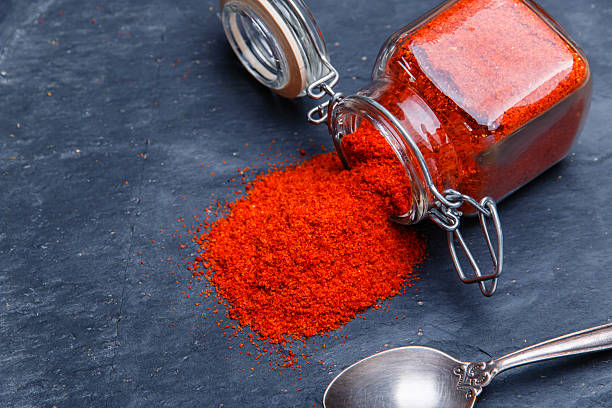 istock powder seasoning spice paprika on a black stone 499336232