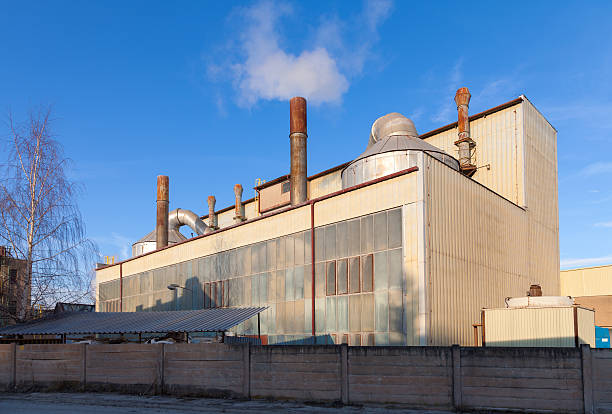 istock Industrial building and blue sky 499339034