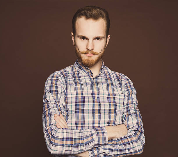 istock Portrait of a young man with a mustache and beard 499340140