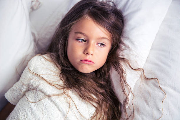 istock Little girl resting in bed 499340688
