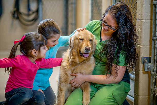 istock Children Petting a Golden Retriever 499343696