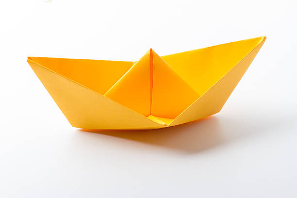 istock origami paper boat 499344224