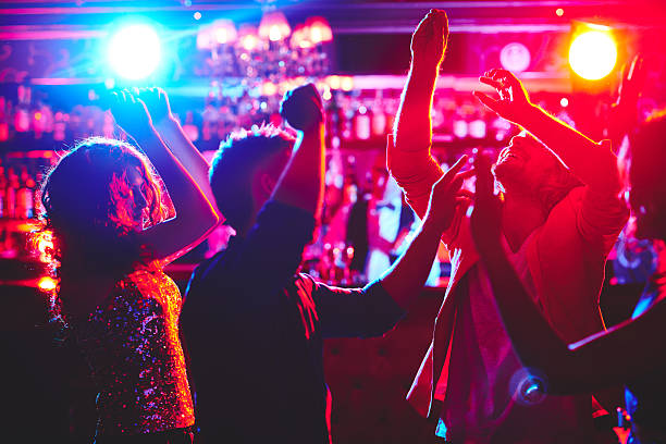 Dance lovers Group of dance lovers enjoying disco in nightclub nightclub stock pictures, royalty-free photos & images