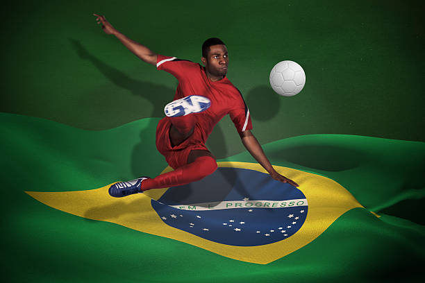 istock Football player in red kicking 499358969