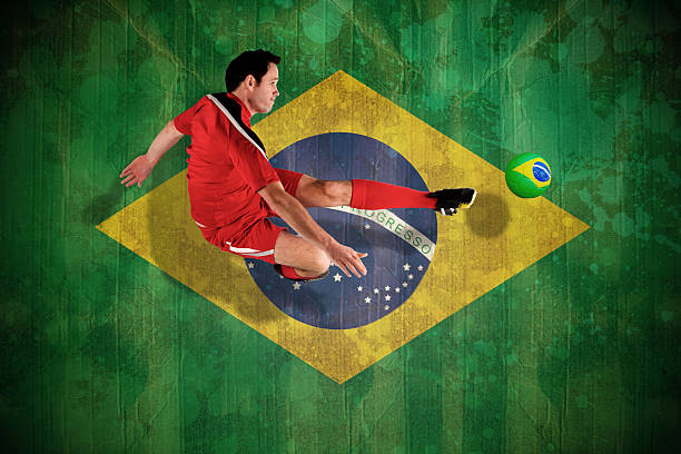 istock Football player in red kicking 499359407