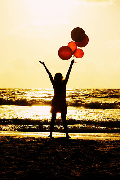 istock beautiful woman on seaside 499359795