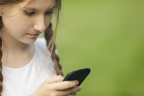 istock teen girl using mobile phone 499360711