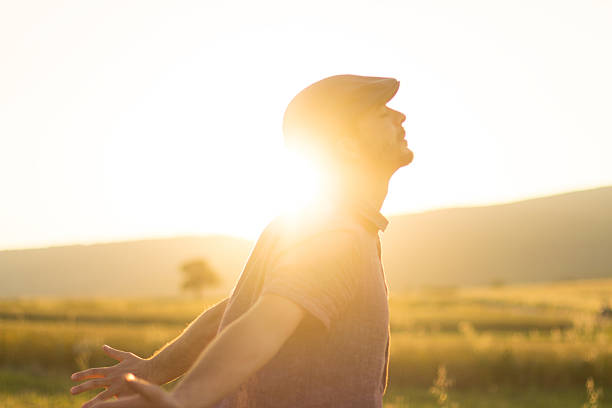 istock man in wheat field and sunlight 499361057