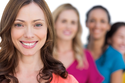 Smling Model Smiling Models In A Line Posing With Focus On Brunette Stock Photo ...