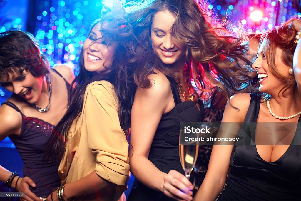 Party time Cheerful girls living it up on the dance floor Ladies' Night Stock Photo