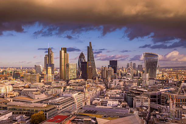 istock Dramatic clouds at sunset over London's business district, UK 499366832