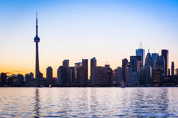 istock Toronto skyscraper skyline reflecting in Lake Ontario at sunset Canada 499367210