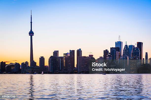 Toronto Skyscraper Skyline Reflecting In Lake Ontario At Sunset Canada Stock Photo - Download Image Now