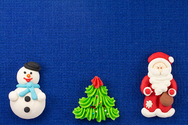 istock Christmas figurines sweet mastic on a blue background 499367532