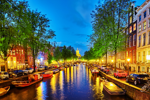 Amsterdam, Netherlands - September 15, 2015: Beautiful Amsterdam city, canals at the evening time. Amsterdam has also called the Venice of the North. Netherlands