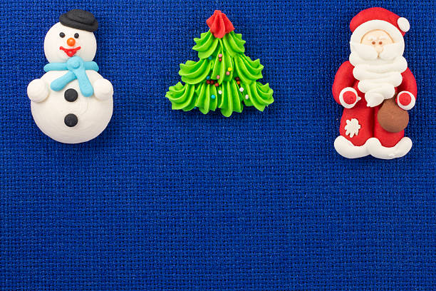 istock Christmas figurines sweet mastic on a blue background 499367798