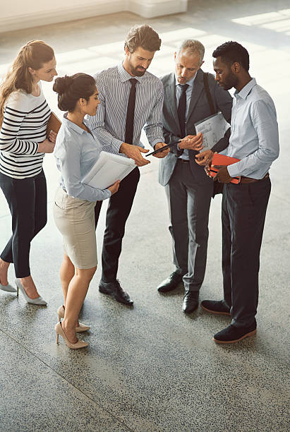 istock Having a quick Q and A before the meeting 499368328