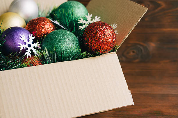istock Christmas decoration in a cardboard box on a wooden background 499368732