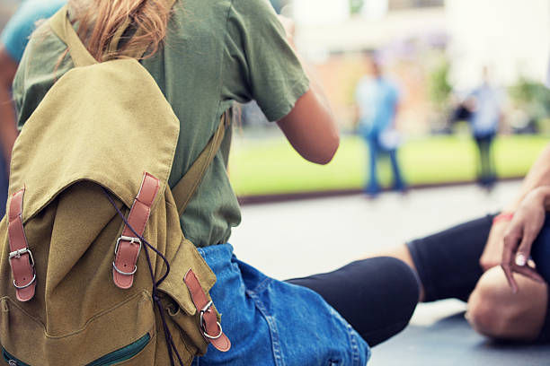 istock students enjoying being outdoors 499368944