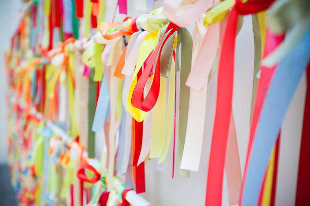 Red ribbon and green ribbon with white background.