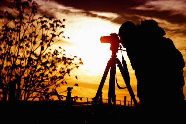 istock Man Photographing at Sunset 499369580