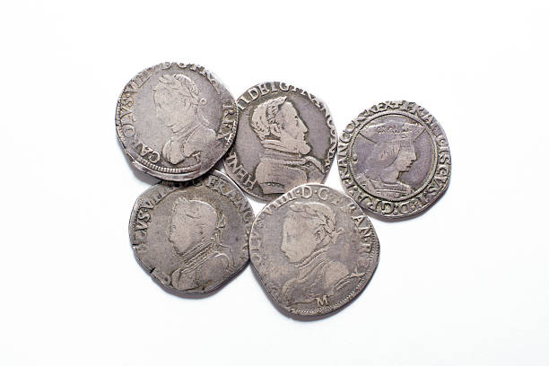 istock Vintage silver coins with portraits on a white background 499370208