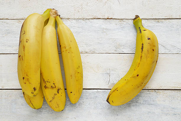 istock Some bananas on a white wooden table. 499370950