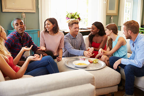 istock Group Of Friends Relaxing At Home On Sofa Together 499372710
