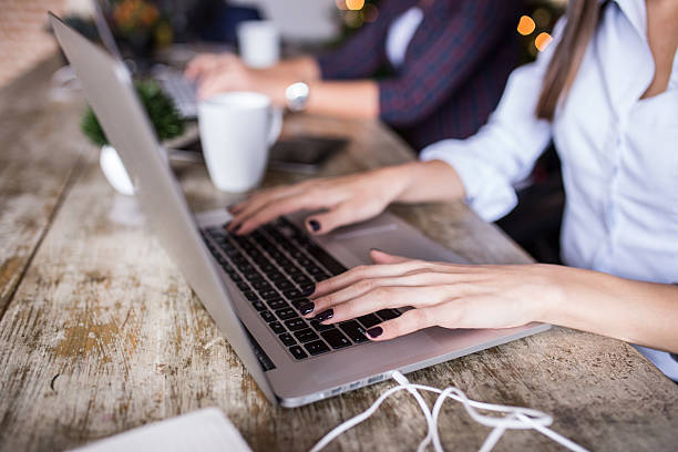 istock Young woman using laptop at home office. Modern office interior, 499373220