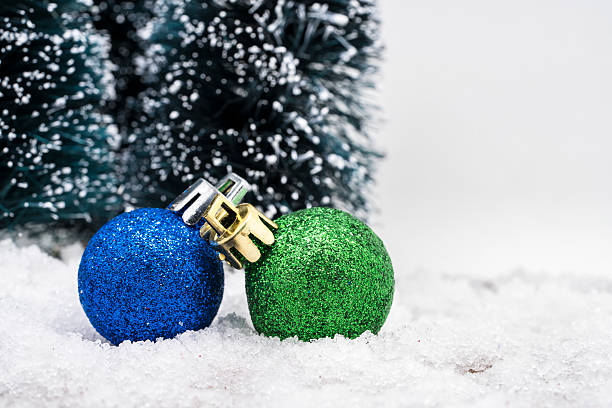 istock Christmas ornaments on snow 499373626