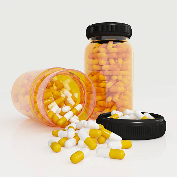istock Medicine bottle with capsules isolated on white background. 499374660