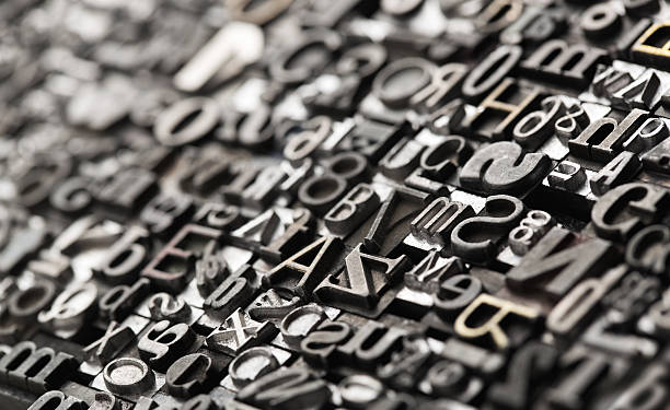 Letterpress background Letterpress background, close up of many old, random metal letters with copy space typescript photos stock pictures, royalty-free photos & images
