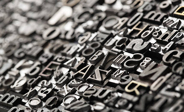 Letterpress background Letterpress background, close up of many old, random metal letters with copy space typesetter stock pictures, royalty-free photos & images