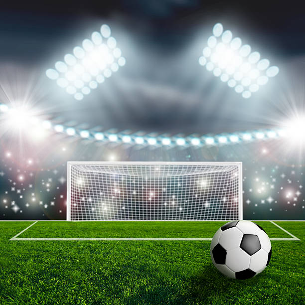 istock Soccer ball on green stadium arena 499376539