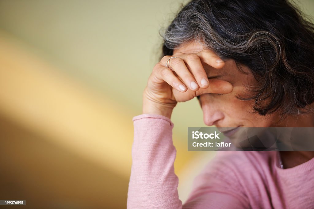 Not feeling too well today Shot of a mature woman resting her head on her handhttp://195.154.178.81/DATA/i_collage/pu/shoots/784547.jpg Emotional Stress Stock Photo
