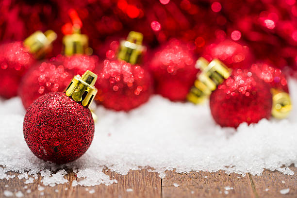 istock Red Christmas balls on snow 499377590