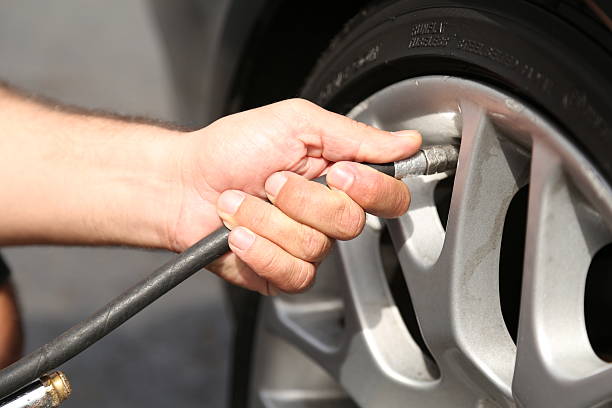 istock filling the tire with air 499378083