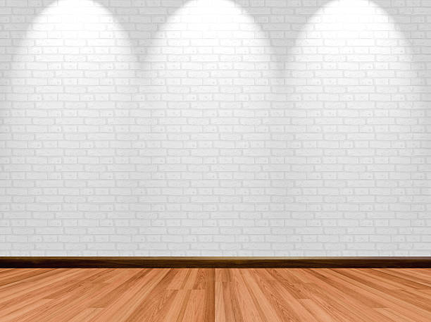 istock Empty room background with wooden floor brick wall and spotlight. 499378942