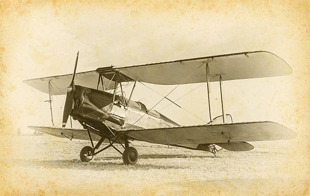 Old airplane Old airplane at the airfield. Air travel with biplane - concept of retro aviation. Retro image of old aircraft. Vintage airplane closeup. piloting photos stock pictures, royalty-free photos & images