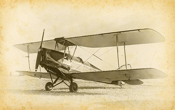 Old airplane Old airplane at the airfield. Air travel with biplane - concept of retro aviation. Retro image of old aircraft. Vintage airplane closeup. fuselage stock pictures, royalty-free photos & images