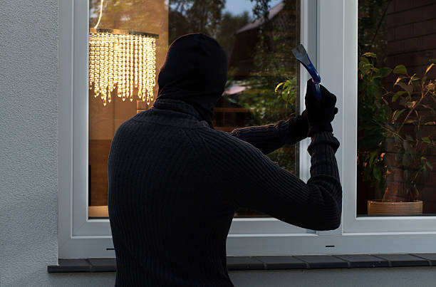 istock The burglar trying to break 499380387