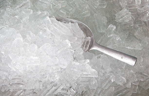 ice with scoop ice with scoop  in ice bucket ice machines stock pictures, royalty-free photos & images
