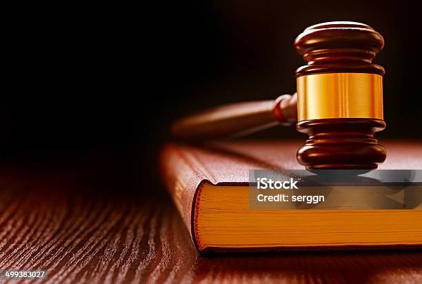 Wood And Brass Judges Gavel On A Law Book Stock Photo - Download Image Now - Authority, Book, Close-up