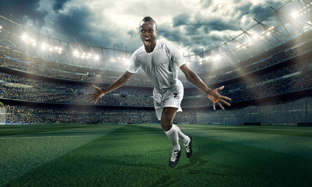 istock Soccer stadium and soccer player happy scoring a goal 499383055