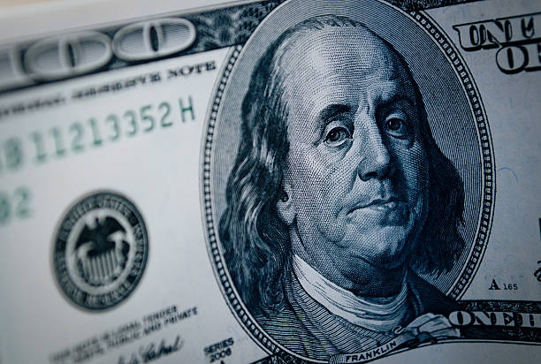 istock Benjamin Franklin portrait on 100 dollar bill 499383885
