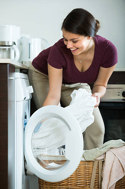 istock Housewife with washed linen 499389254