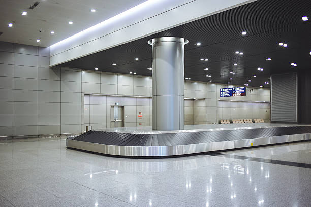 istock Baggage conveyor belt in the airport 499389344
