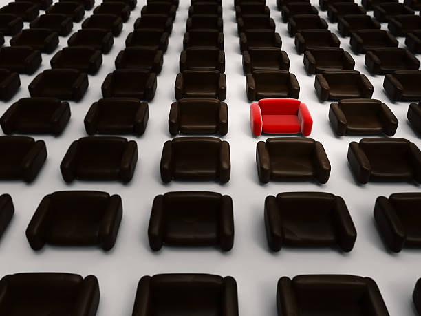 istock 3d rendering red armchair among black armchairs 499389630